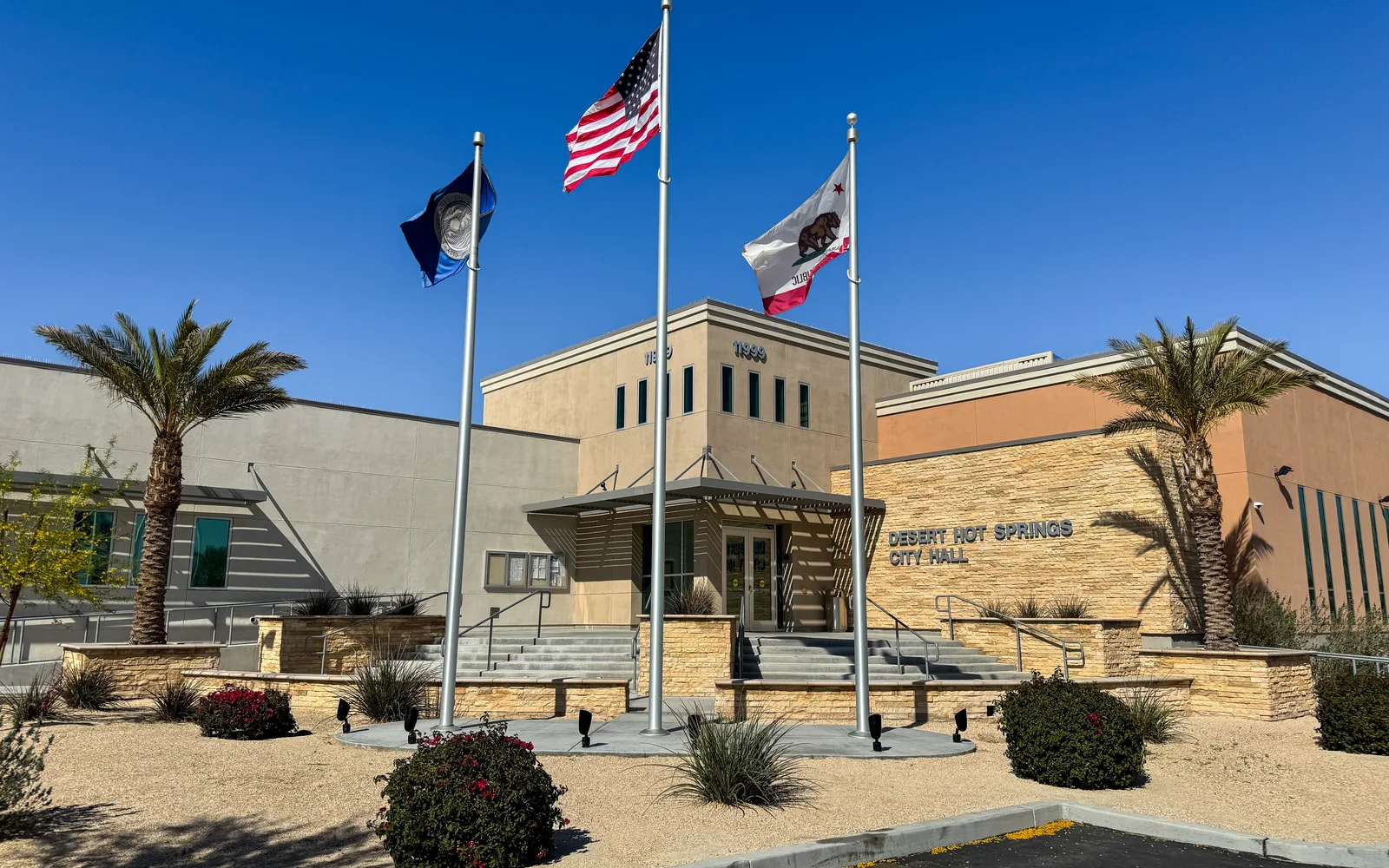 Desert Hot Springs City Hall with flagpoles and desert landscaping